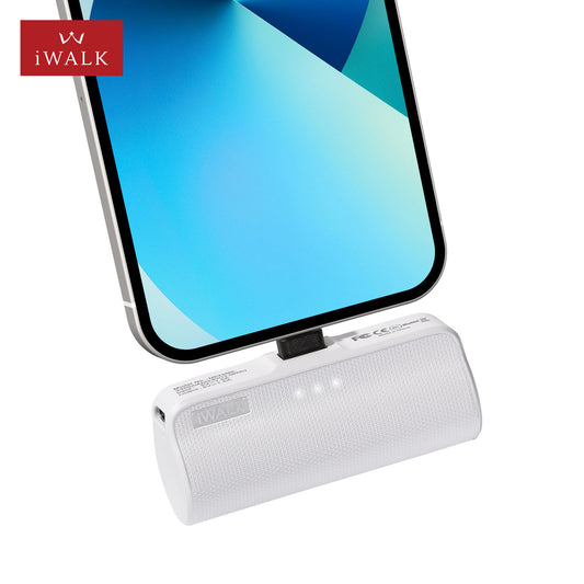 White power bank with smartphone on a white background, featuring iWALK branding.