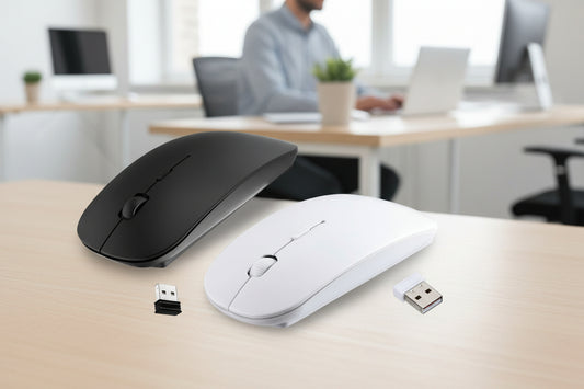 Two wireless computer mice on a desk with USB receiver in front, blurred office background.