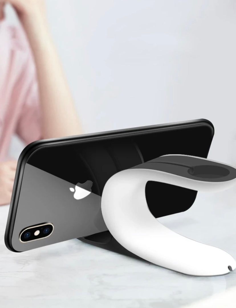 Phone holder with a smartphone on a white surface