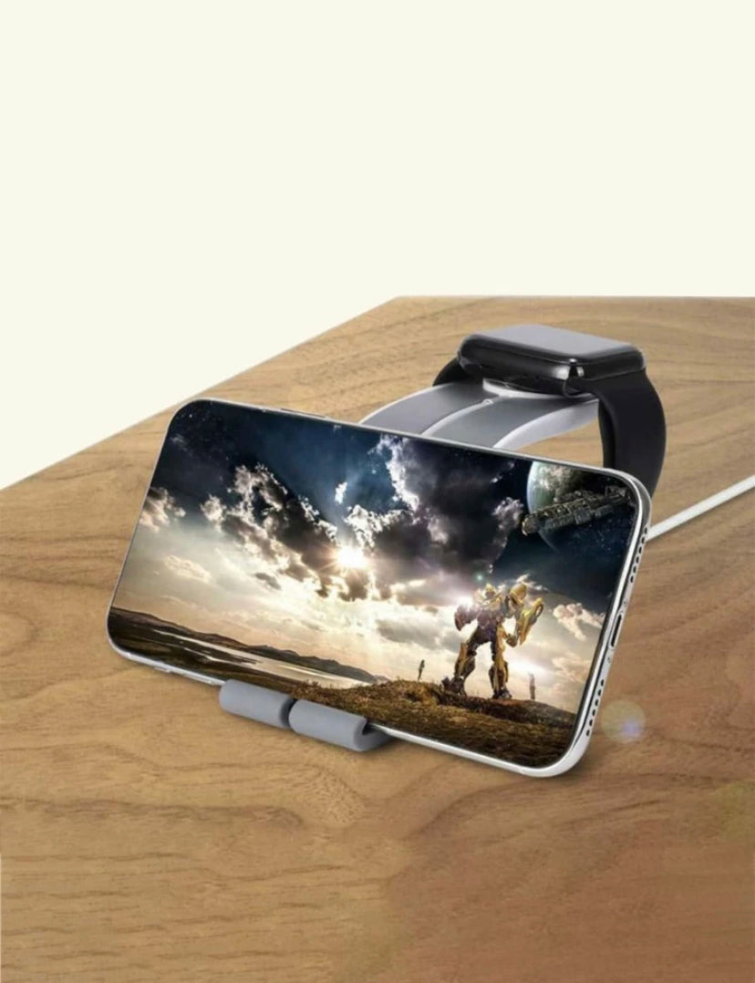 Smartphone with a landscape display on a stand, placed on a wooden surface.