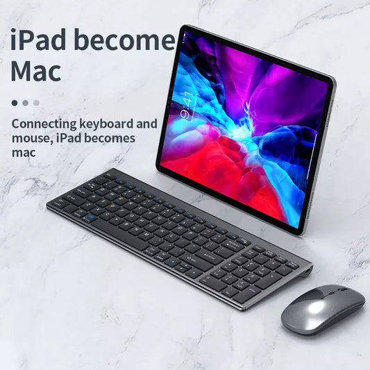 Tablet with keyboard and mouse on a marble surface, text 'iPad becomes Mac'.