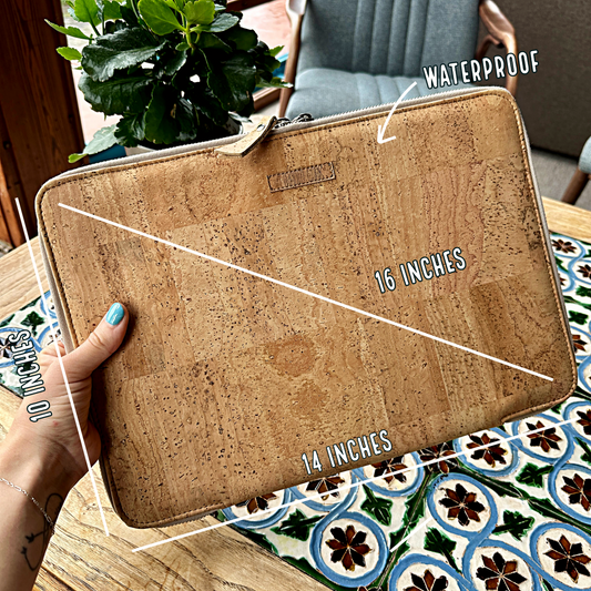 Cork laptop sleeve held by a hand with measurements and waterproof label on a patterned table.