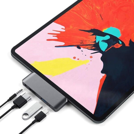 Tablet with a colorful display and a USB hub on a white background