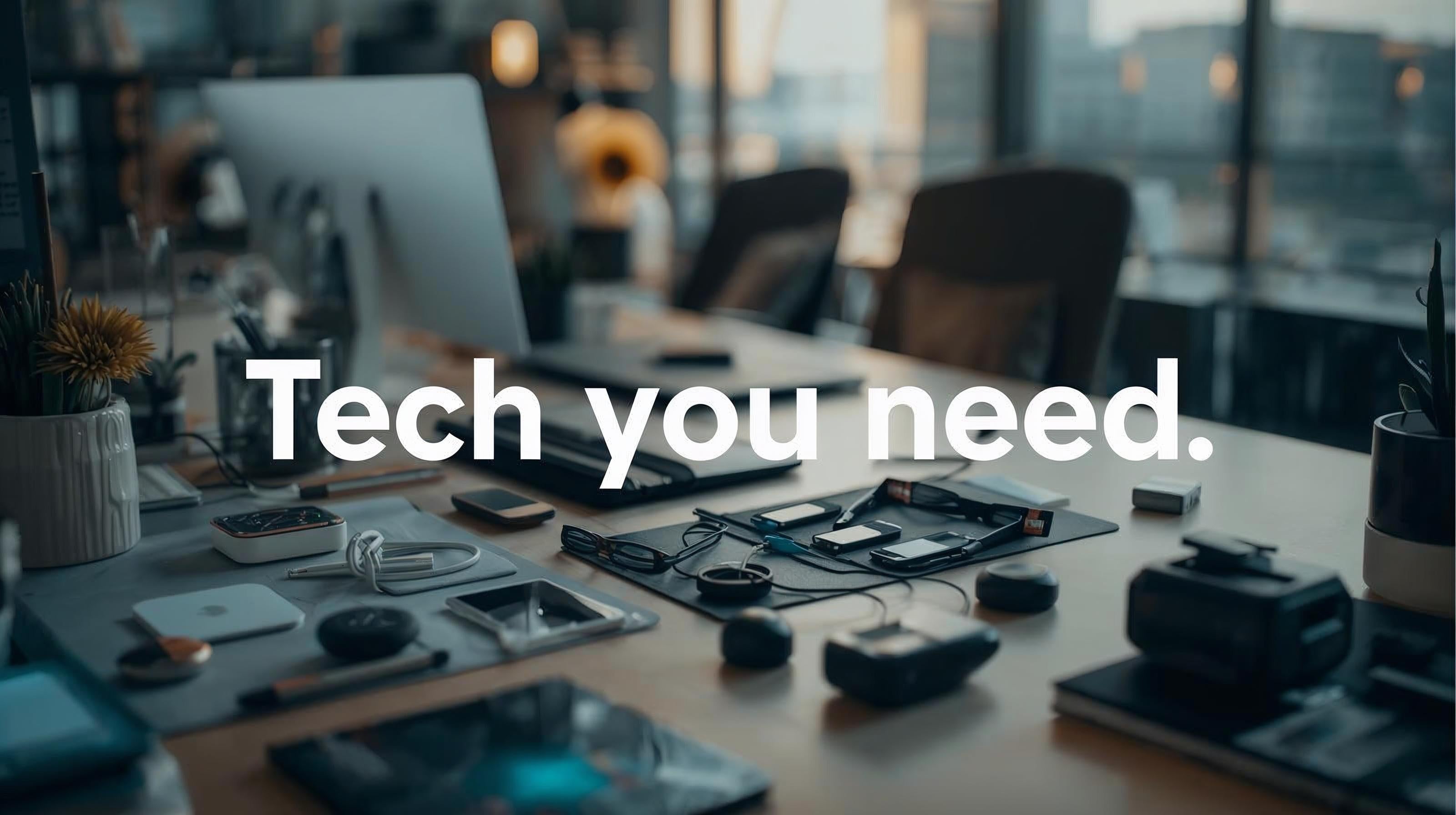 Table with technology equipment and 'Tech you need' text overlay