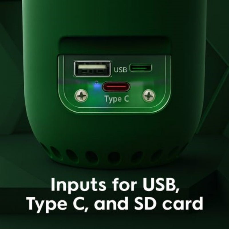 Close-up of a green electronic device with USB, Type C, and SD card inputs on a dark background.