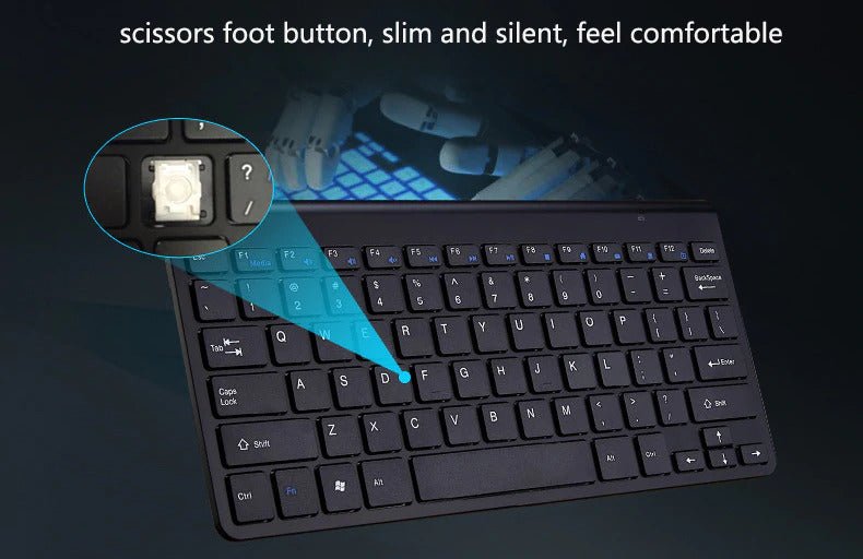 Black keyboard with close-up of scissors foot button on a dark background